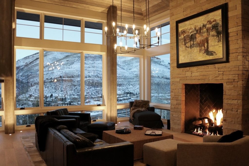 Living room with fireplace and mountain view